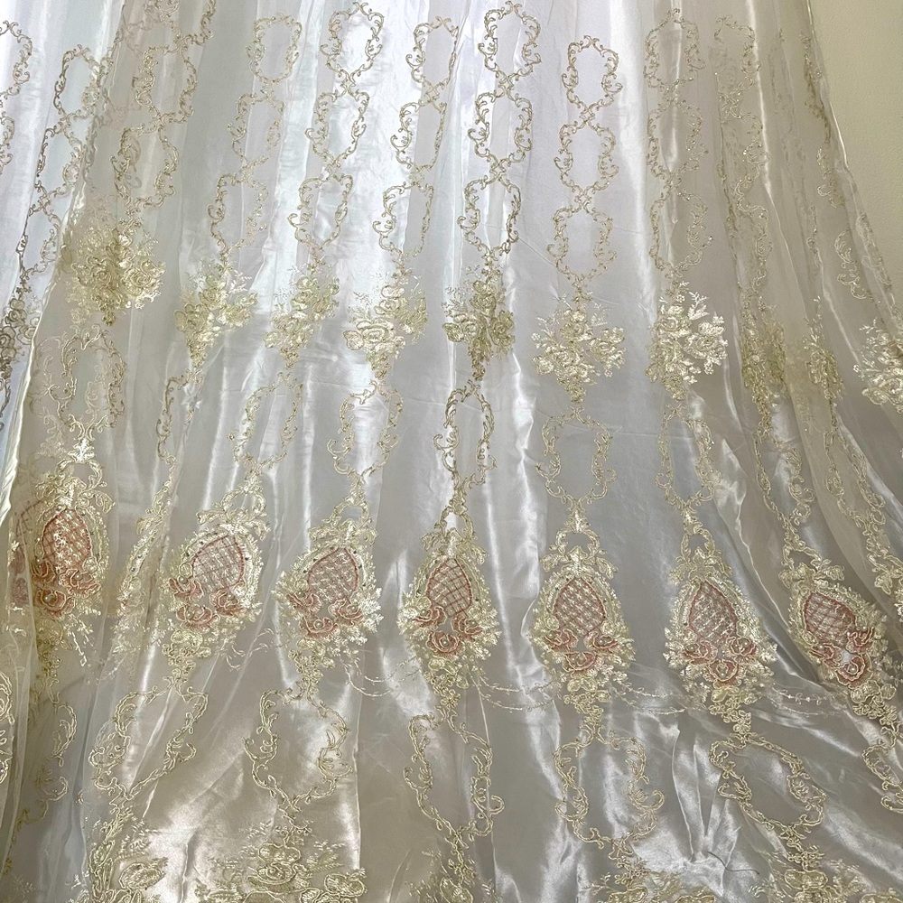 White curtains with beige/gold details